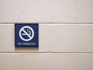 No Smoking Sign hanging on wall.