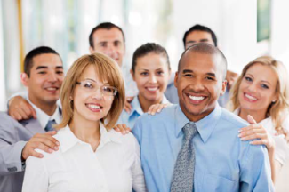 Stock image of office workers smiling for group picture.