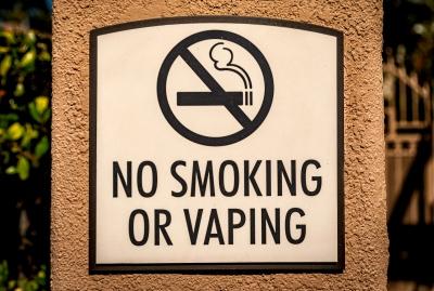 Sign that says "NO SMOKING OR VAPING"