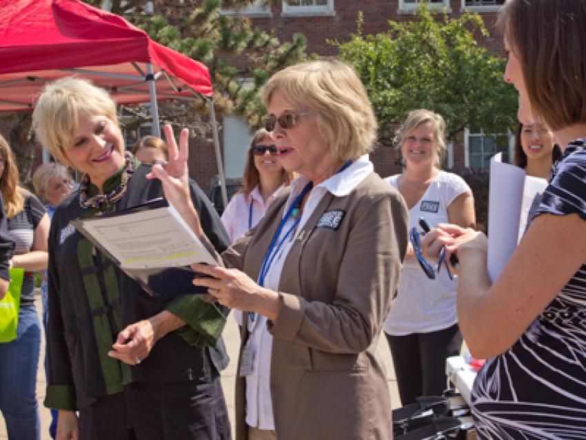 Ellen Hahn speaking in front of a crowd.