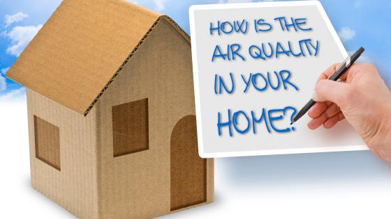 Raphic showing a house and a person writing "How is the air quality in your home?" on a piece of paper.